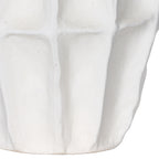 Detail of the vase's lower body, showing softly raised panels and fine speckling in the matte-white surface.