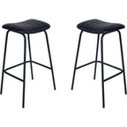 Pair of charcoal bar stools with parallel-stitched seats, slender black legs and footrests against a white background.