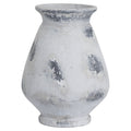 Patch Urn Vase with a flared rim, rounded body and white finish marked by irregular grey patches, shown against white.
