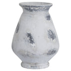 Patch Urn Vase with a flared rim, rounded body and white finish marked by irregular grey patches, shown against white.