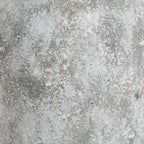 Close-up of the Patchneck Vase surface with irregular pale patches, grey areas and small darker marks.