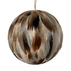Close-up of the bauble's overlapping feather-like elements, showing fine dark markings, warm brown patches and wispy edges.