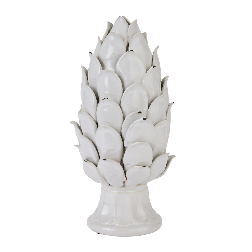 Full view of an ivory-white artichoke ornament with overlapping pointed scales and a flared circular pedestal against a white background.
