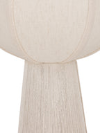 Detail of the woven cream shade and its curved textured bands where it meets the rope-covered lamp base.