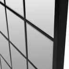 Angled close-up of the Pier mirror showing bevelled glass panes, black grid divisions and the depth of the outer frame.