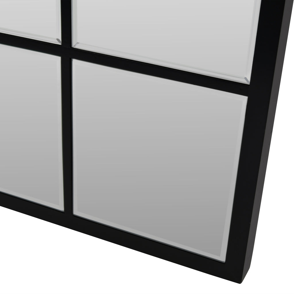 Close-up of the Pier mirror's lower right corner, showing the black frame and bevelled edges around the individual panes.