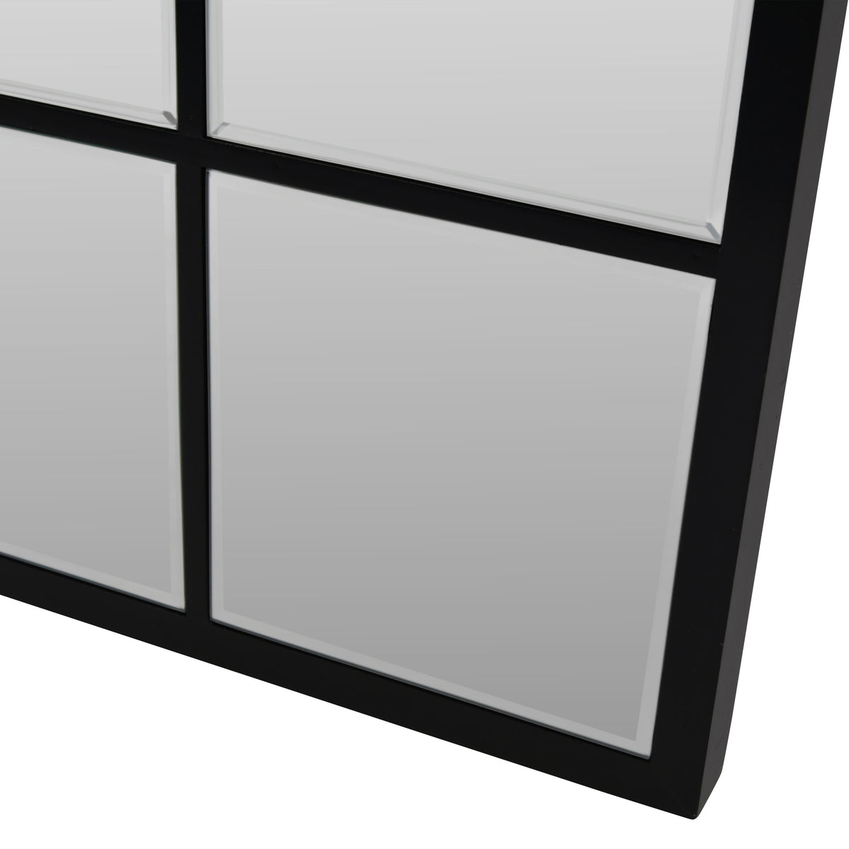 Close-up of the Pier mirror's lower right corner, showing the black frame and bevelled edges around the individual panes.