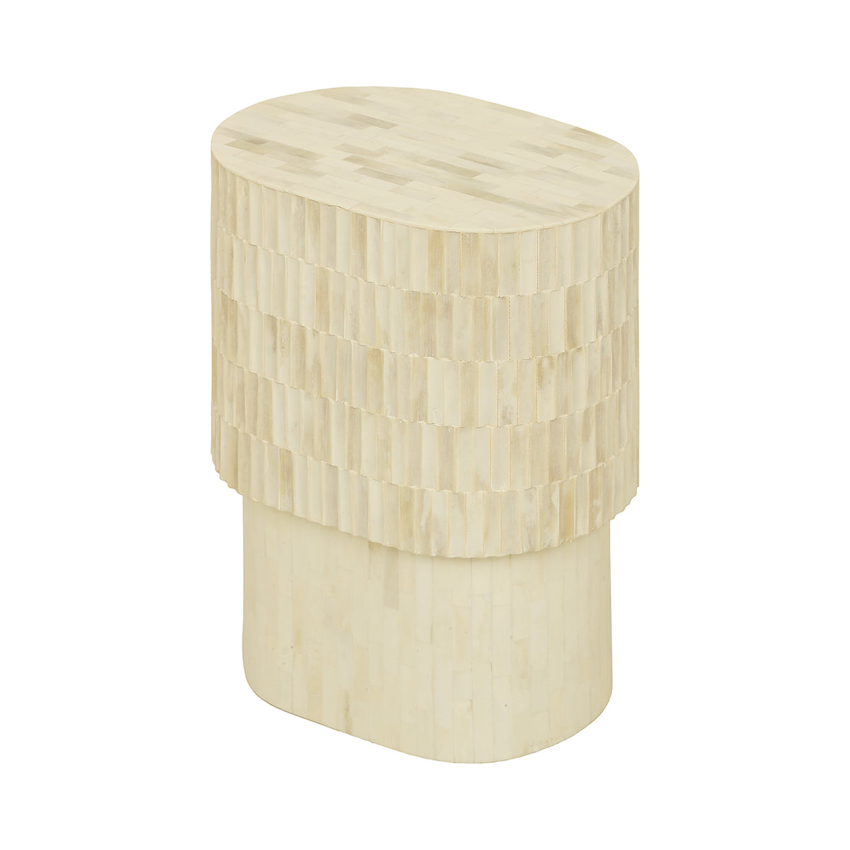 Angled view of the Pietra Side Table showing its asymmetric rounded top and pale patchwork inlay.