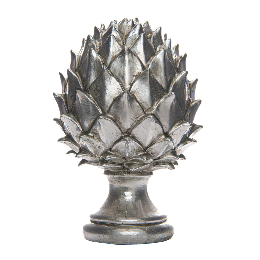 Silver-coloured pinecone finial with overlapping pointed scales, a narrow neck and rounded stepped pedestal base on a white background.