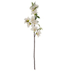 Full view of an artificial flower spray with ivory-white blooms and green leaves branching from a long dark brown stem against white.
