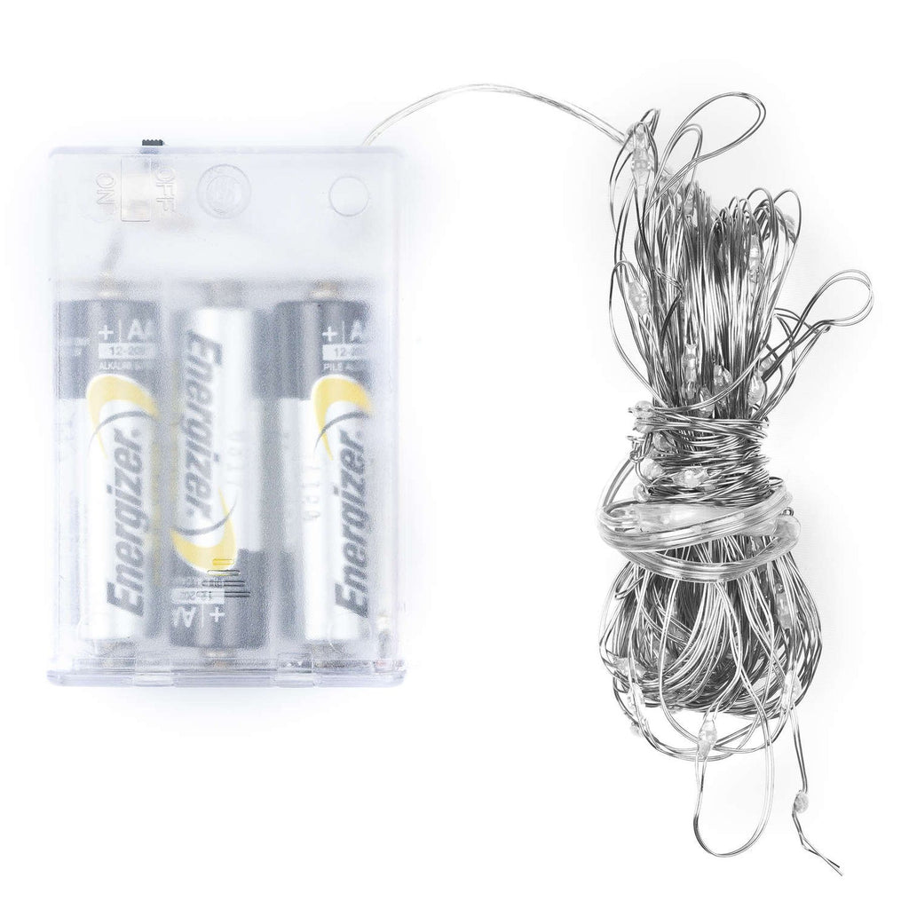 Coiled silver-coloured light wire beside a clear battery box with batteries visible inside, on a white background.