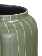 Close-up of the open rim and shoulder, with pale pinstripes curving across glossy green enamel.