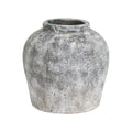 Pitted Round Vase on a white background, showing rounded shoulders, a thick rim and mottled grey-white surface.