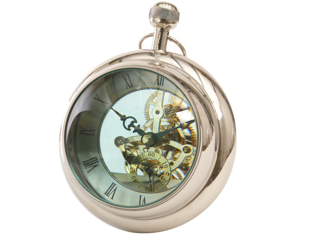 Angled view of the round polished nickel clock, showing its deep case, curved front, Roman numerals, gold-toned mechanism and pocket-watch-style crown and loop.
