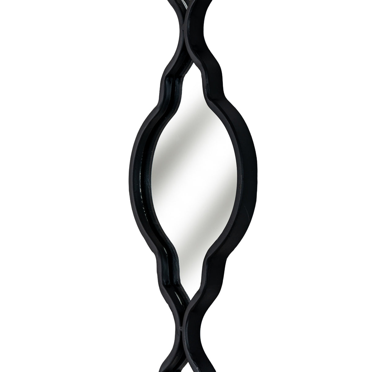Angled close-up of a mirrored section showing the depth of its black edging around the curved sides and pointed lower end.