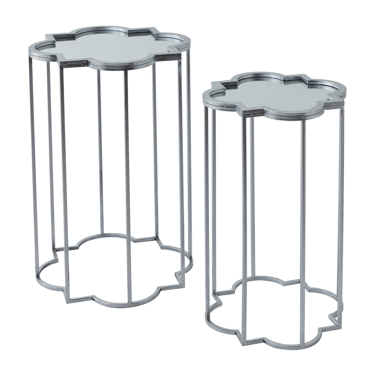 Larger and smaller silvery-grey side tables standing apart, with shaped raised rims, slender legs and matching open base outlines.