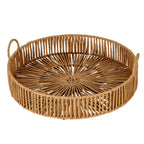 Warm brown round tray viewed from above at an angle, showing the radial open weave, looped sides and two raised handles.