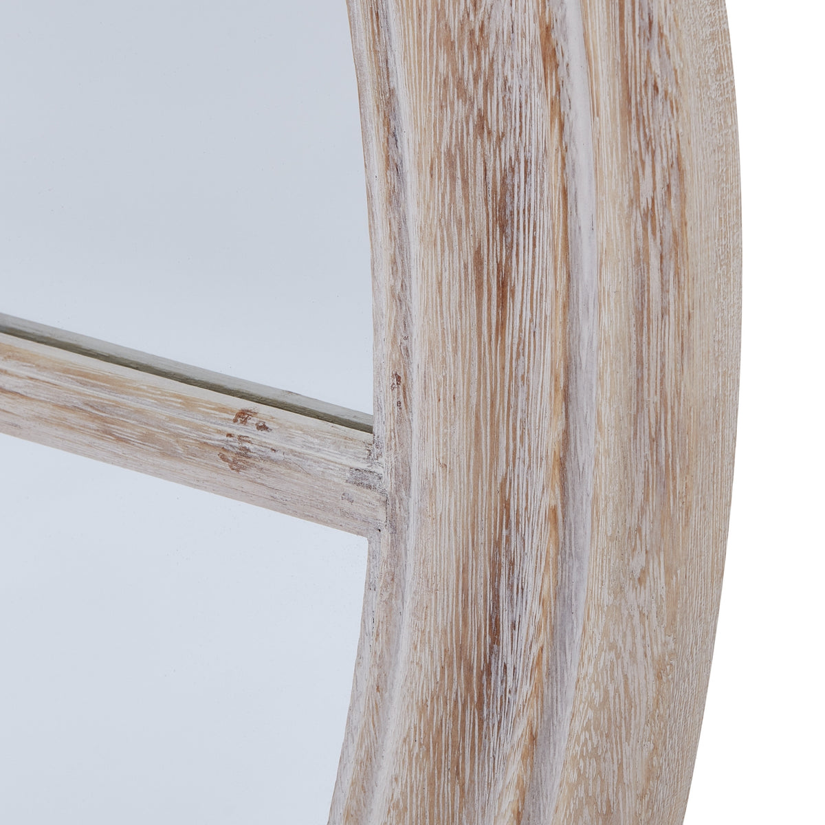 Detail of the curved outer frame and a horizontal divider, showing streaks of pale finish and warmer brown patches.