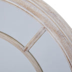 Close-up of a diagonal divider joining the inner ring to the ridged outer frame, with pale wash over warm beige markings.