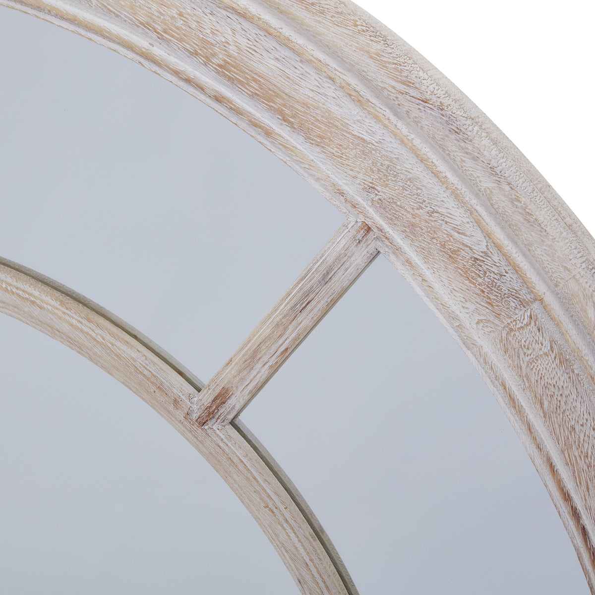 Close-up of a diagonal divider joining the inner ring to the ridged outer frame, with pale wash over warm beige markings.