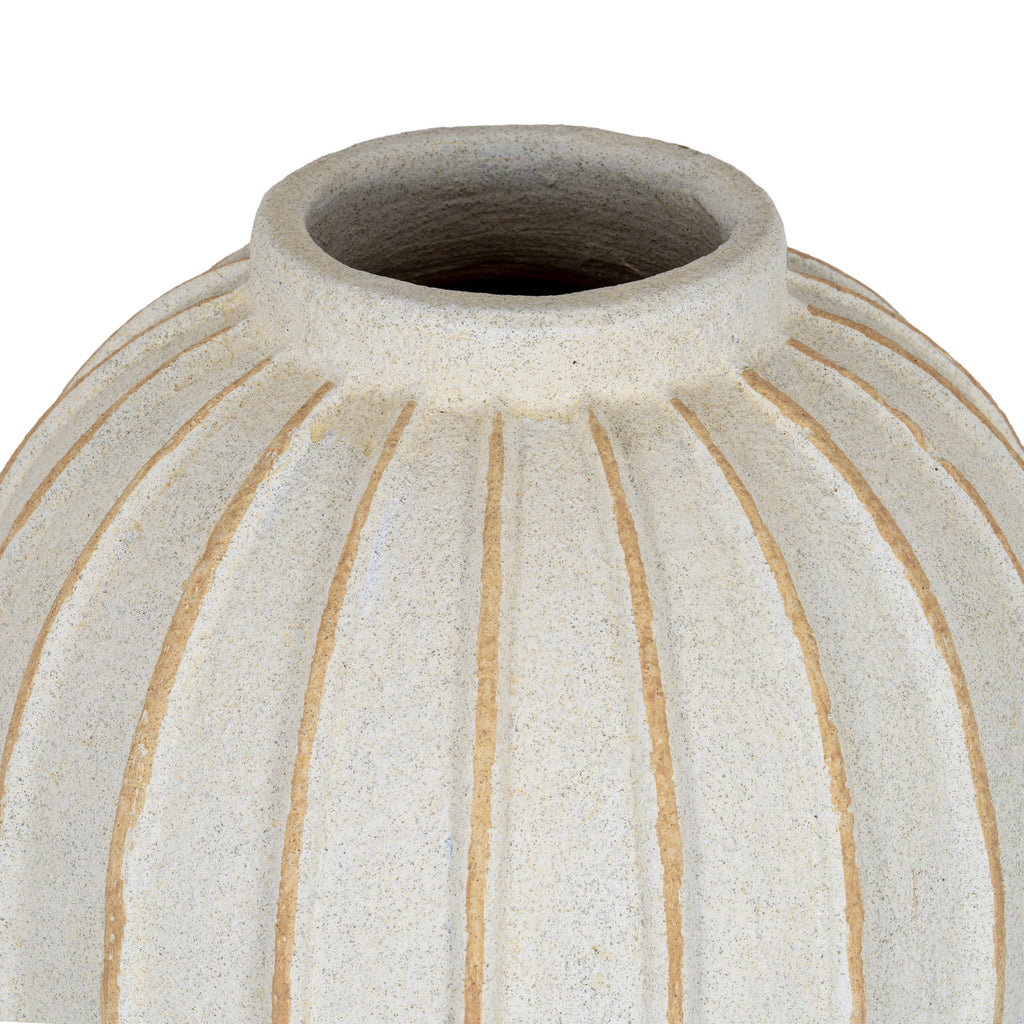 Close view of the vase's open neck and rounded shoulder, showing the speckled cream-white surface and tan grooves spreading downwards.