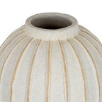 Close view of the vase's open neck and rounded shoulder, showing the speckled cream-white surface and tan grooves spreading downwards.