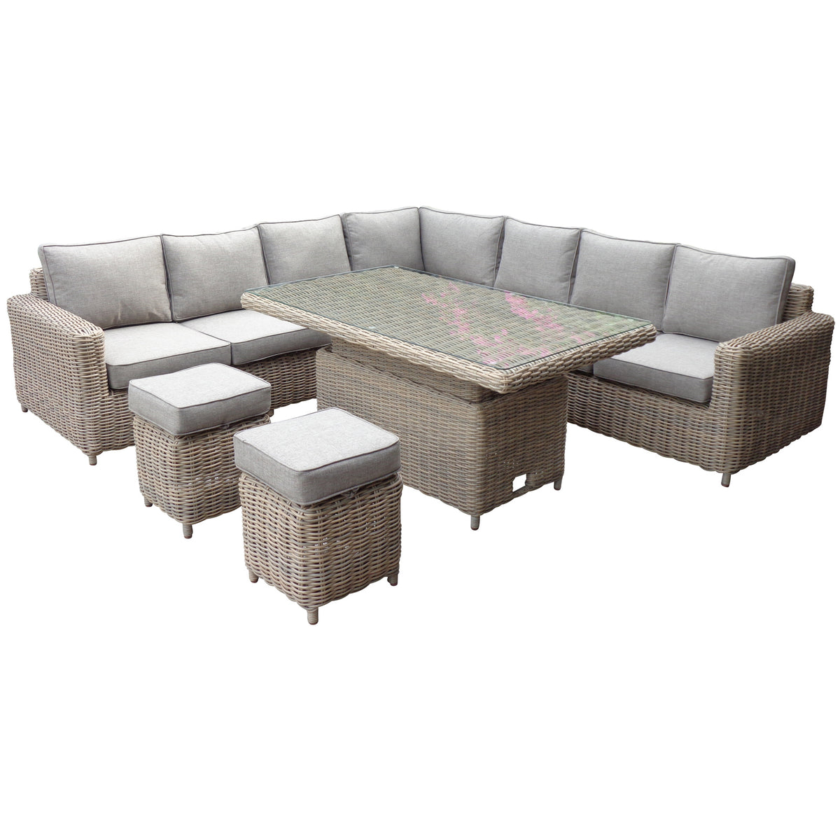 Woven L-shaped corner seating with pale cushions and raised end arms, shown with a higher rectangular table and two square cushioned stools on white.