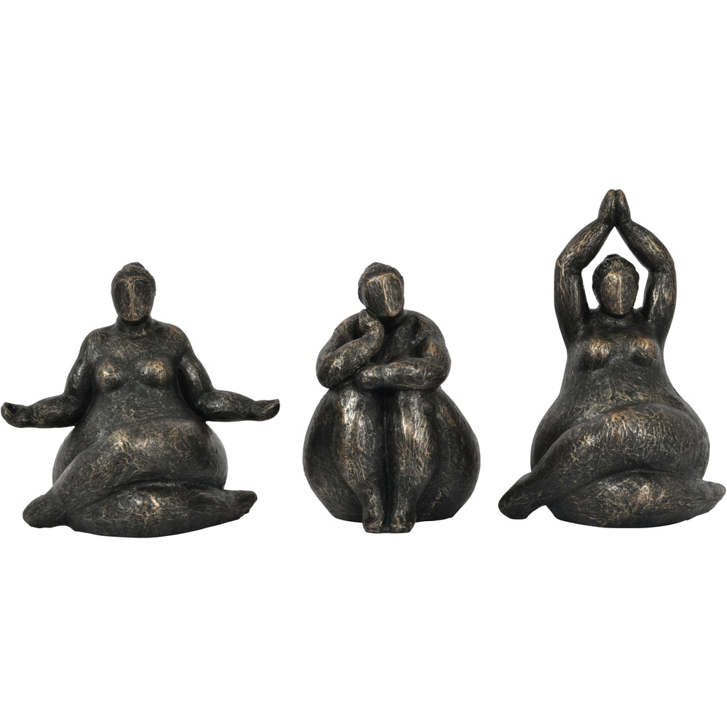 Three bronze-finish seated figure sculptures in different poses, with the raised-arms figure on the right.