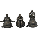 Three bronze-finish seated figure sculptures in different poses, with the raised-arms figure on the right.