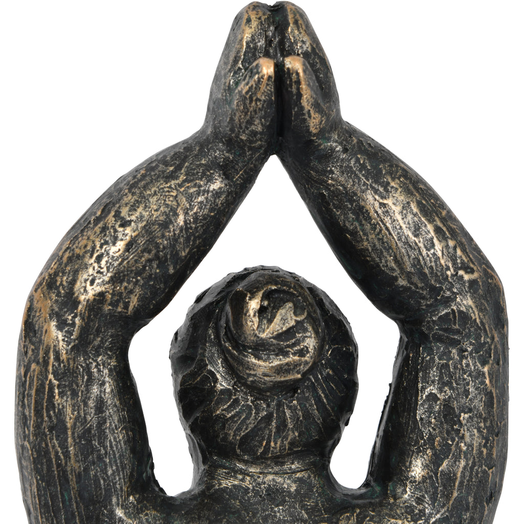 Rear close-up of the figure's joined hands, raised arms and hair bun with bronze highlights over a dark textured finish.