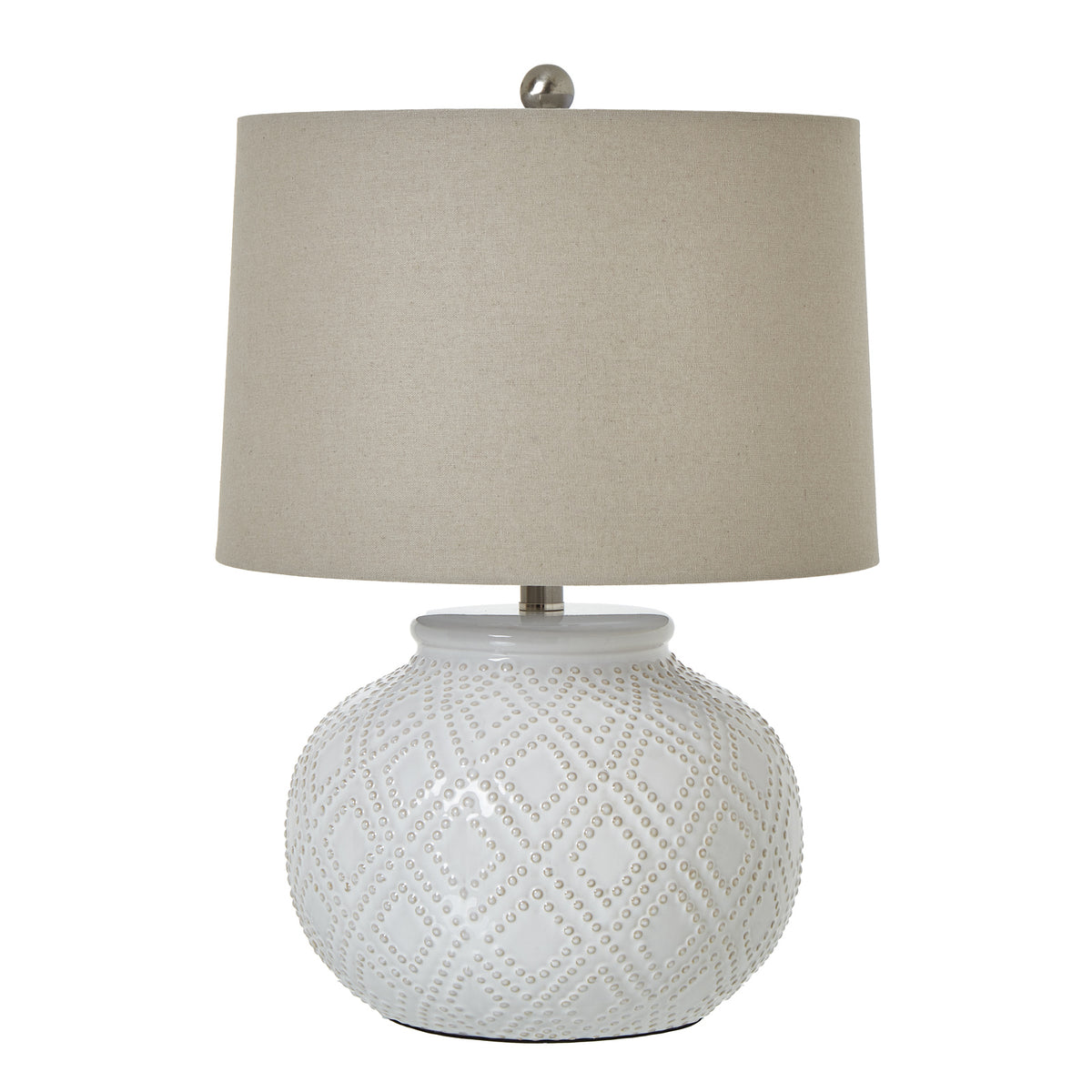 White table lamp with a rounded raised-bead base, pale drum shade and silver-toned finial against a white background.