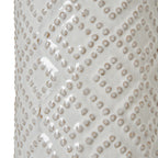Close-up of the glossy off-white lamp base, showing rounded raised dots in diagonal diamond bands with warm beige shading.