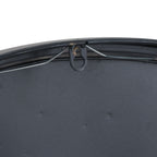 Rear detail of the clock showing its black backing, central hanging loop and a wire running beneath the upper rim.