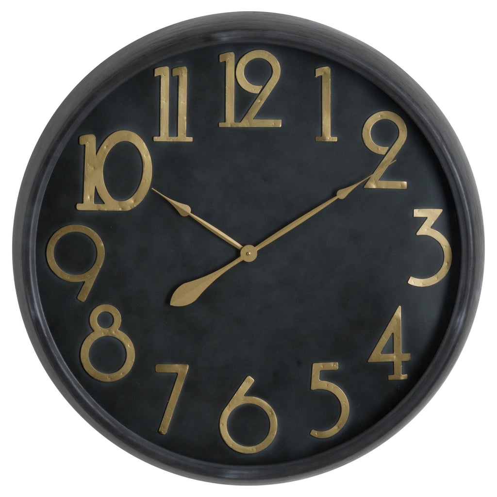 Round black wall clock with raised gold-toned Arabic numerals, matching slender hands and a dark rounded rim.