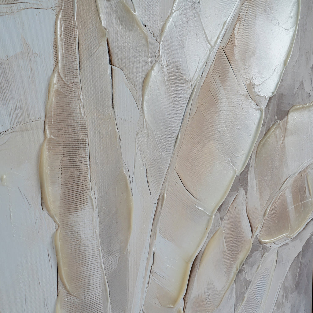 Close-up of cream and beige leaf forms with fine linear markings, visible canvas texture and glossy raised edges.