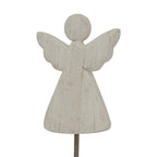 Close view of the angel's round head, scalloped wings and flared body, showing brown markings across the pale finish.