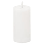 White pillar LED candle against a white background, showing its rounded top, shallow recess and unlit flame-shaped element on a short dark stem.