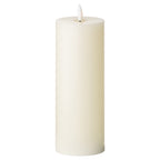 Tall ivory LED pillar candle against a white background, showing straight sides, a recessed top and a white flame-shaped element.