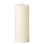 Tall ivory LED candle on a white background, showing plain cylindrical sides, a recessed top and a white flame-shaped element.