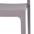 Close-up of the grey chair's slatted seat and front corner, showing the matte, finely pebbled surface and curved transition to the leg.