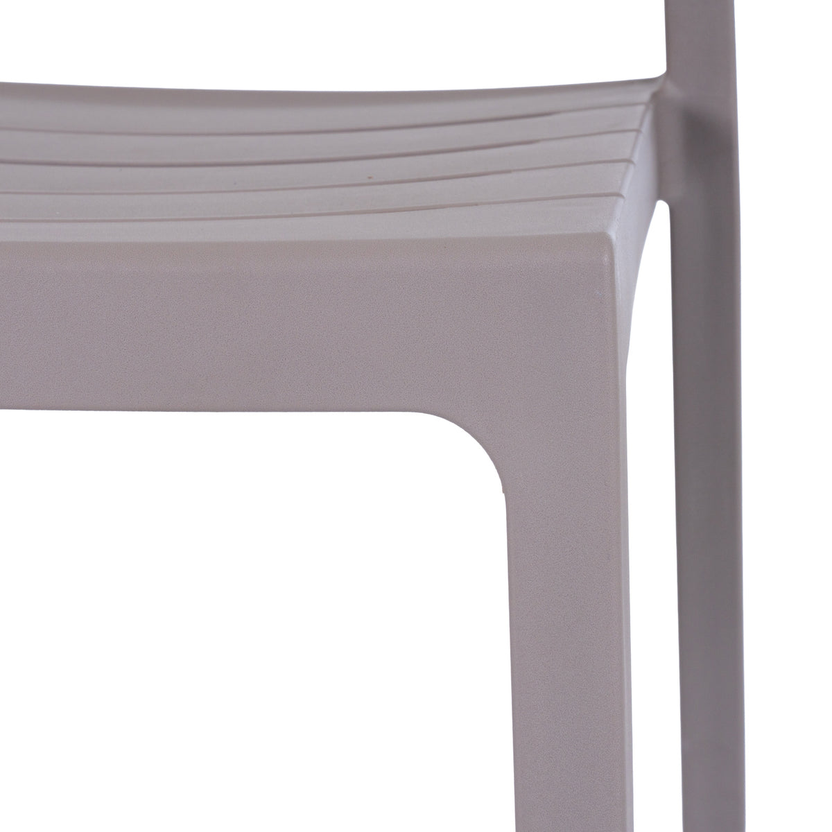 Close-up of the grey chair's slatted seat and front corner, showing the matte, finely pebbled surface and curved transition to the leg.