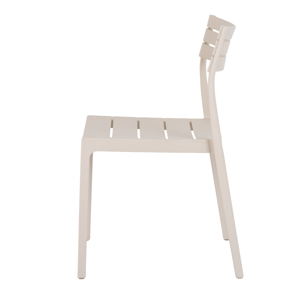 Side view of the pale putty dining chair showing its gently reclined back, curved slats and slightly splayed rear legs.