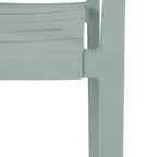 Close-up of the green-grey chair's slatted seat edge and front leg, showing the fine pebbled matte surface.
