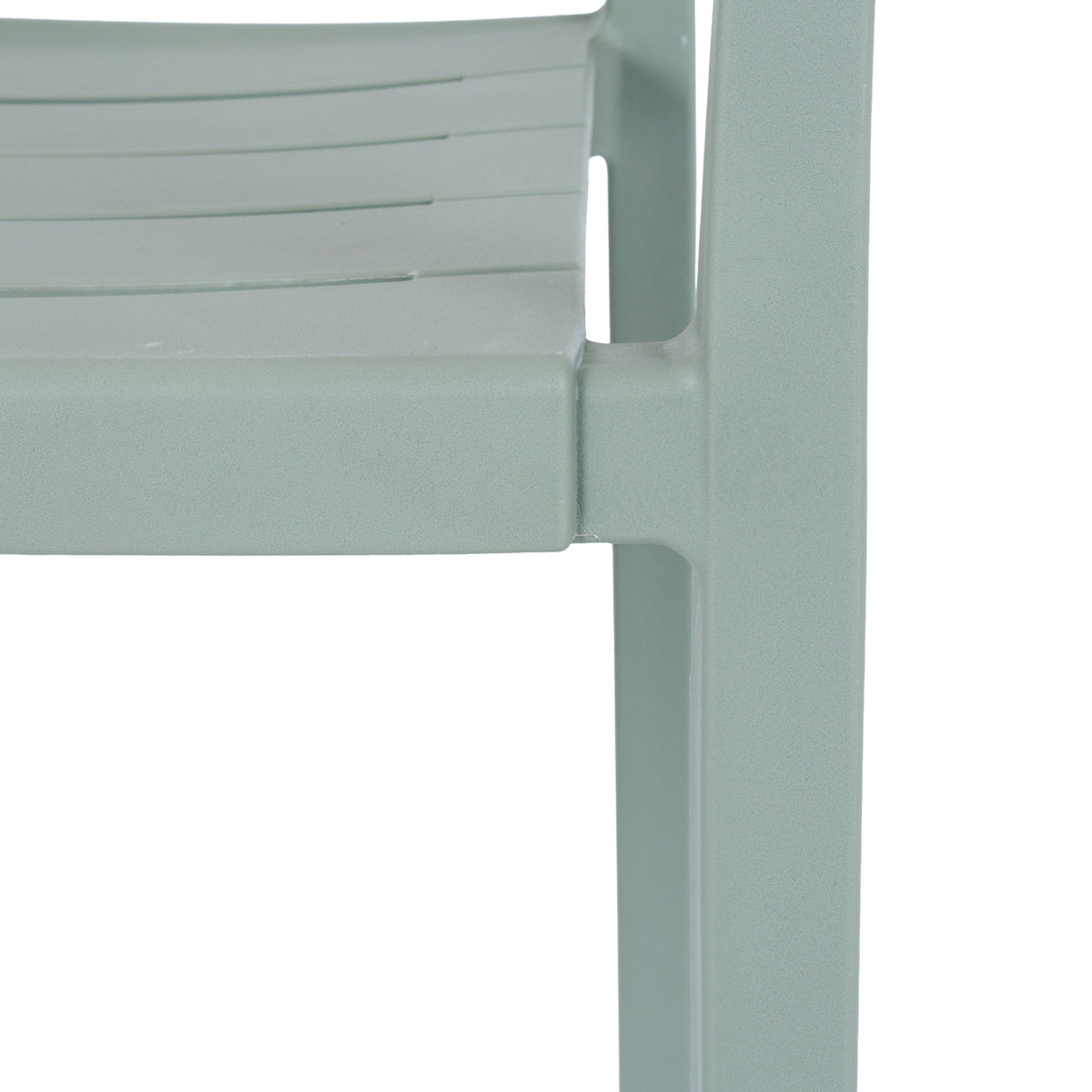 Close-up of the green-grey chair's slatted seat edge and front leg, showing the fine pebbled matte surface.