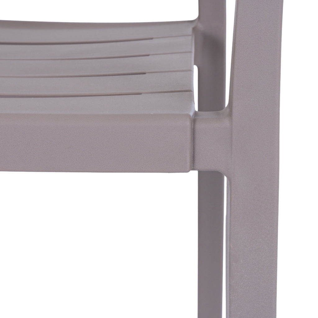 Close-up of the grey chair's slatted seat and front leg, showing the fine pebbled texture of the matte surface.