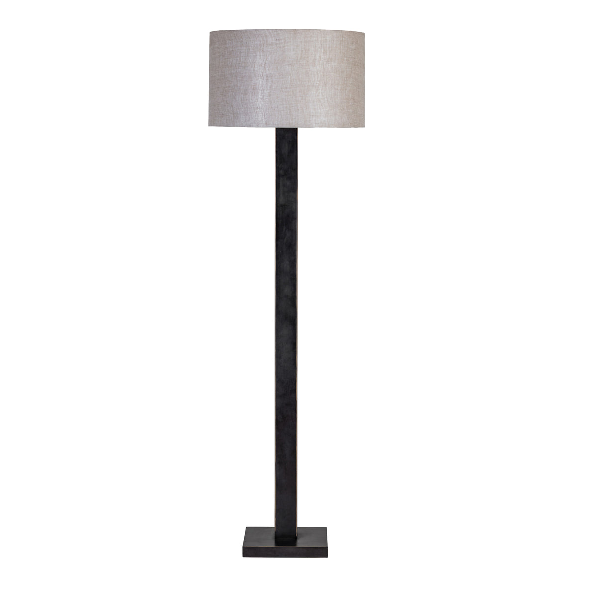 Front view of the floor lamp with a natural fabric drum shade, dark rectangular stem and square base against white.