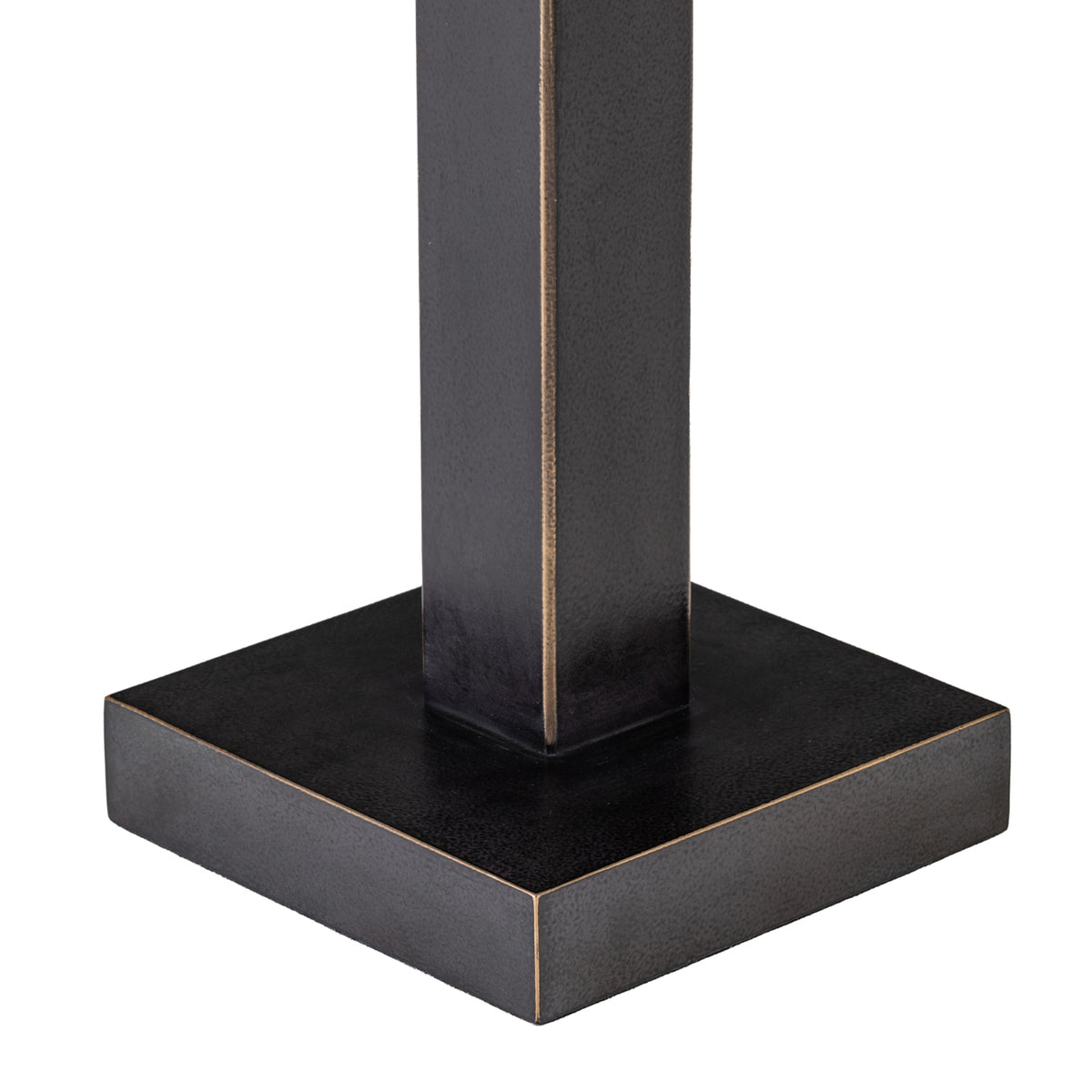 Close-up of the lamp's square base and lower stem, showing the dark textured finish and fine warm-toned edging.