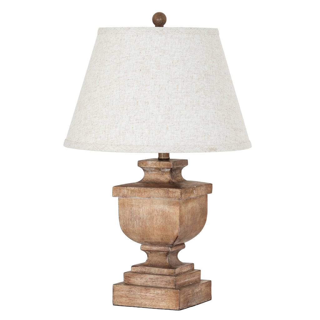 Table lamp with a warm-brown rectangular urn-shaped base, stepped square plinth, pale tapered shade and ball finial.