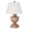 Table lamp with a warm-brown rectangular urn-shaped base, stepped square plinth, pale tapered shade and ball finial.