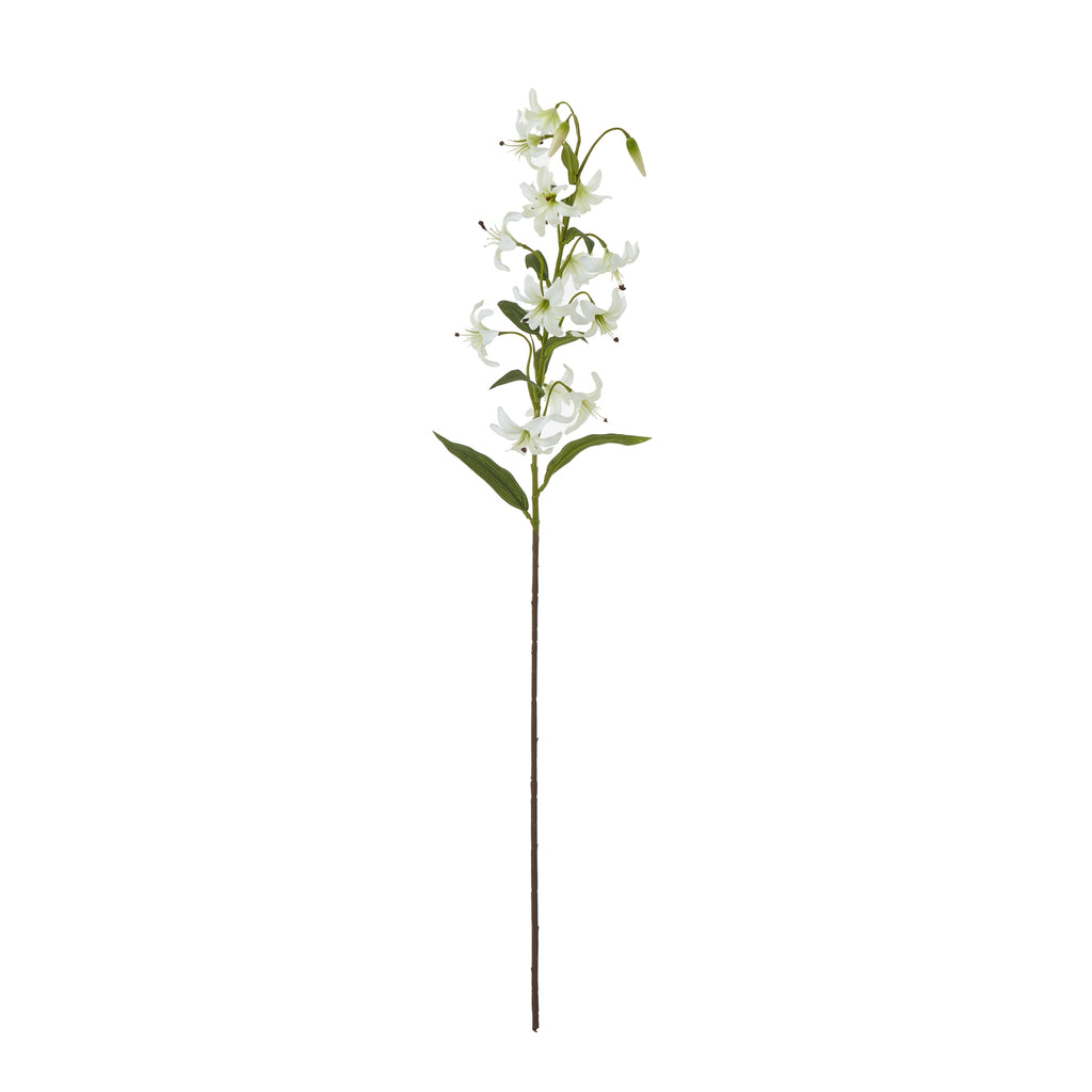 Full view of an artificial flower spray with a long brown stem, branching white recurved blooms, hanging buds and narrow green leaves against white.